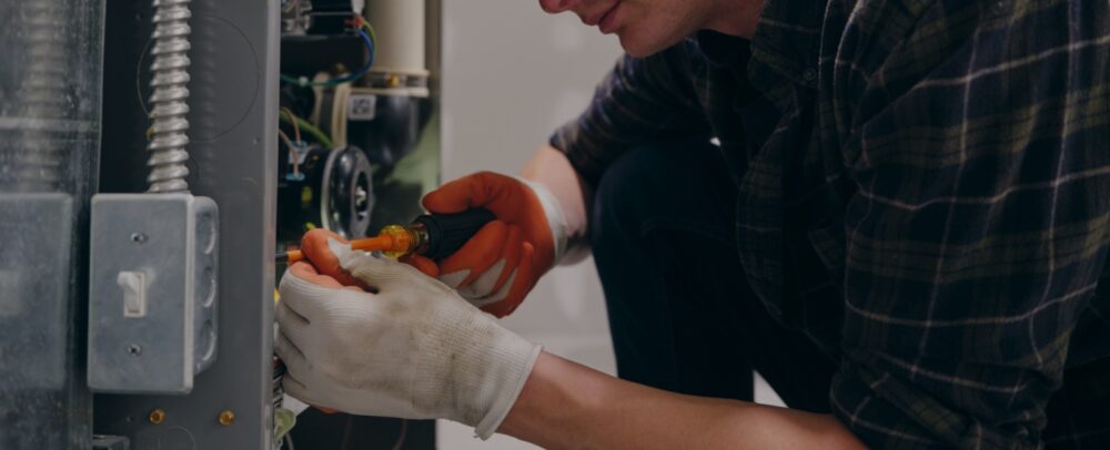 Service man installing furnace